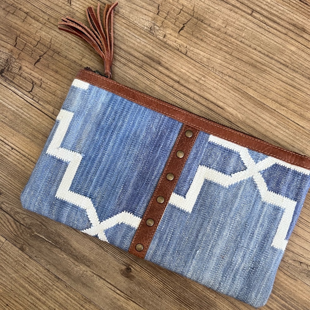 Denim and leather clutch
